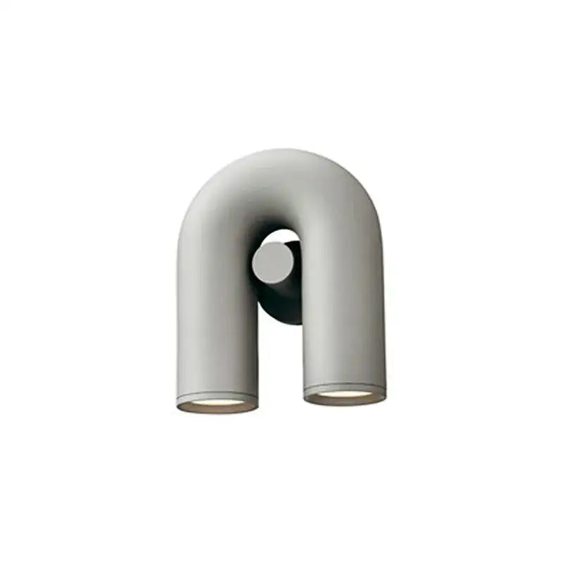 Modern black and silver minimalist tube wall lamp with u-shaped matte gray cylindrical arms for bedroom lighting