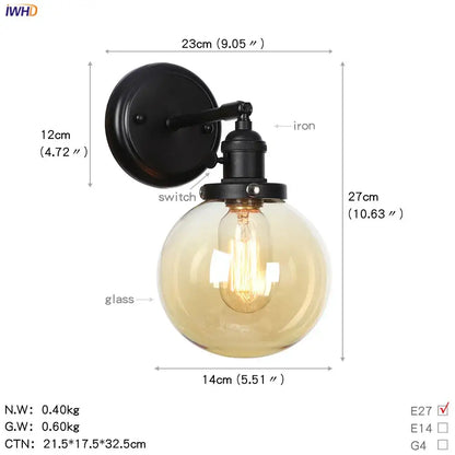 Modern black iron wall sconce with frosted amber decorbites glass ball and exposed filament bulb for hallway lighting