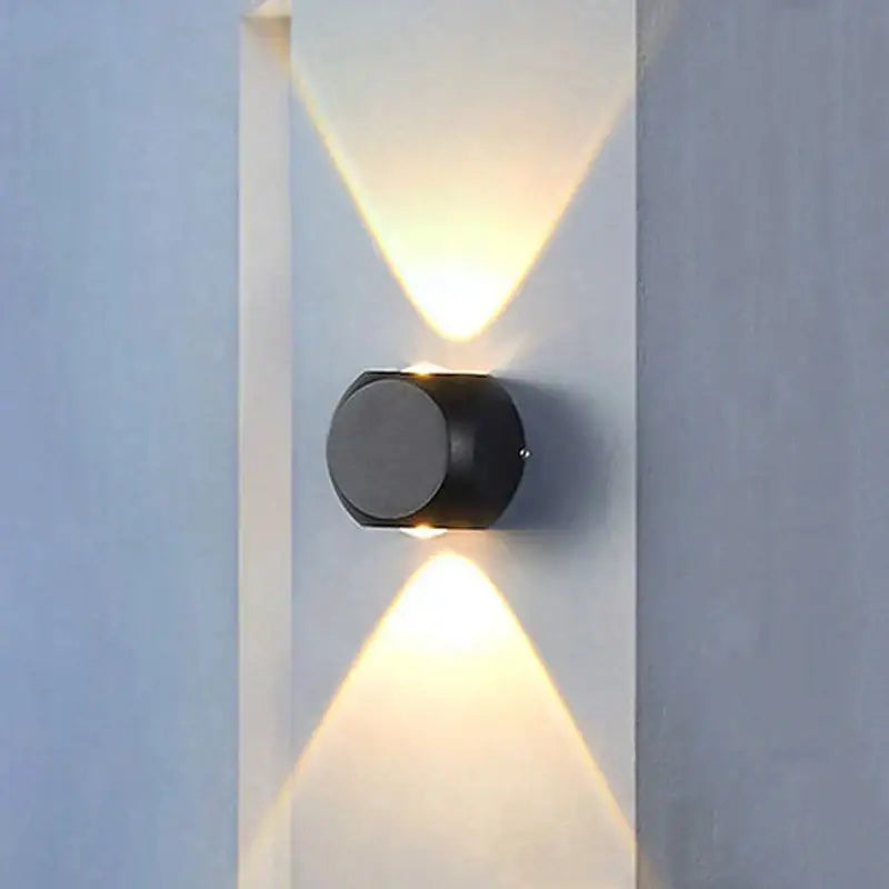 Modern black square led wall light featuring a cylindrical design with dual angled lights for outdoor use
