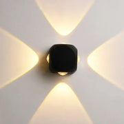 Modern black square led wall light with four warm-toned beams for outdoor garden wall light decor