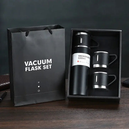 Modern black stainless steel insulated water bottle gift set with vacuum insulated water flask and matching mugs