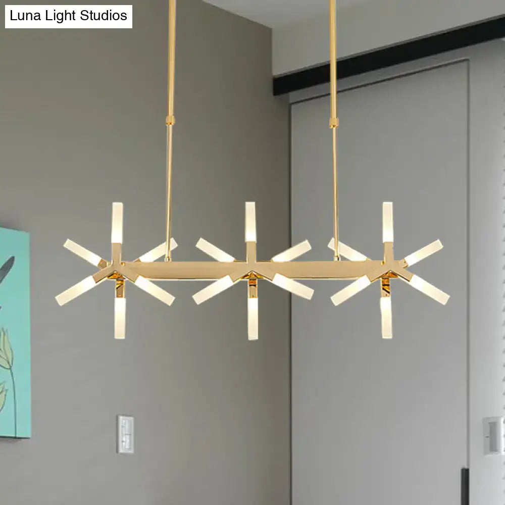 Gold-toned decorbites linear acrylic shade chandelier with starburst arms and frosted glass ideal over dining island