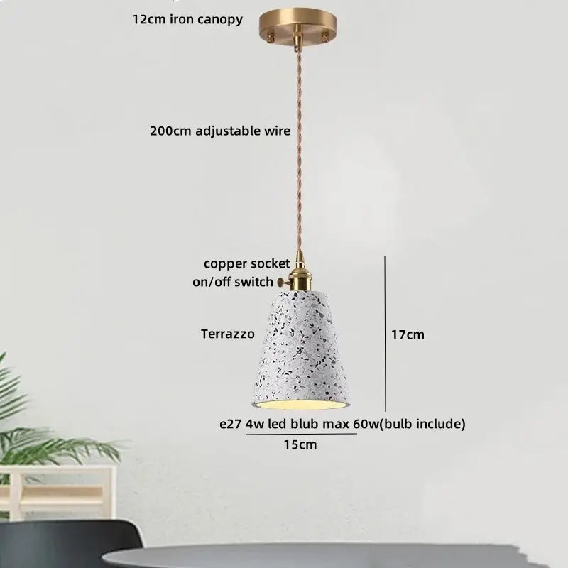 White terrazzo pendant lamp with black speckles, brass canopy, and copper socket for modern dining decorbites black terrazzo