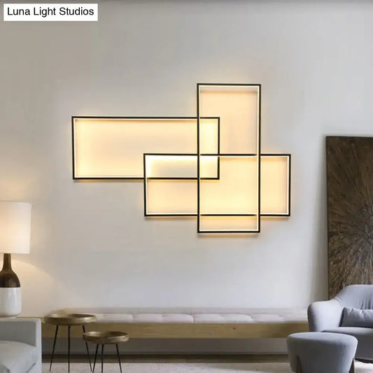 Modern black traverse wall light with geometric black frames and warm white glowing rectangular panels for living room