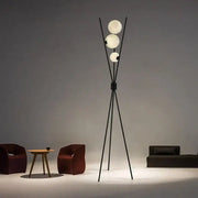 Modern black tripod moon floor lamp with three frosted white spherical bulbs perfect for living room decorbites moon floor