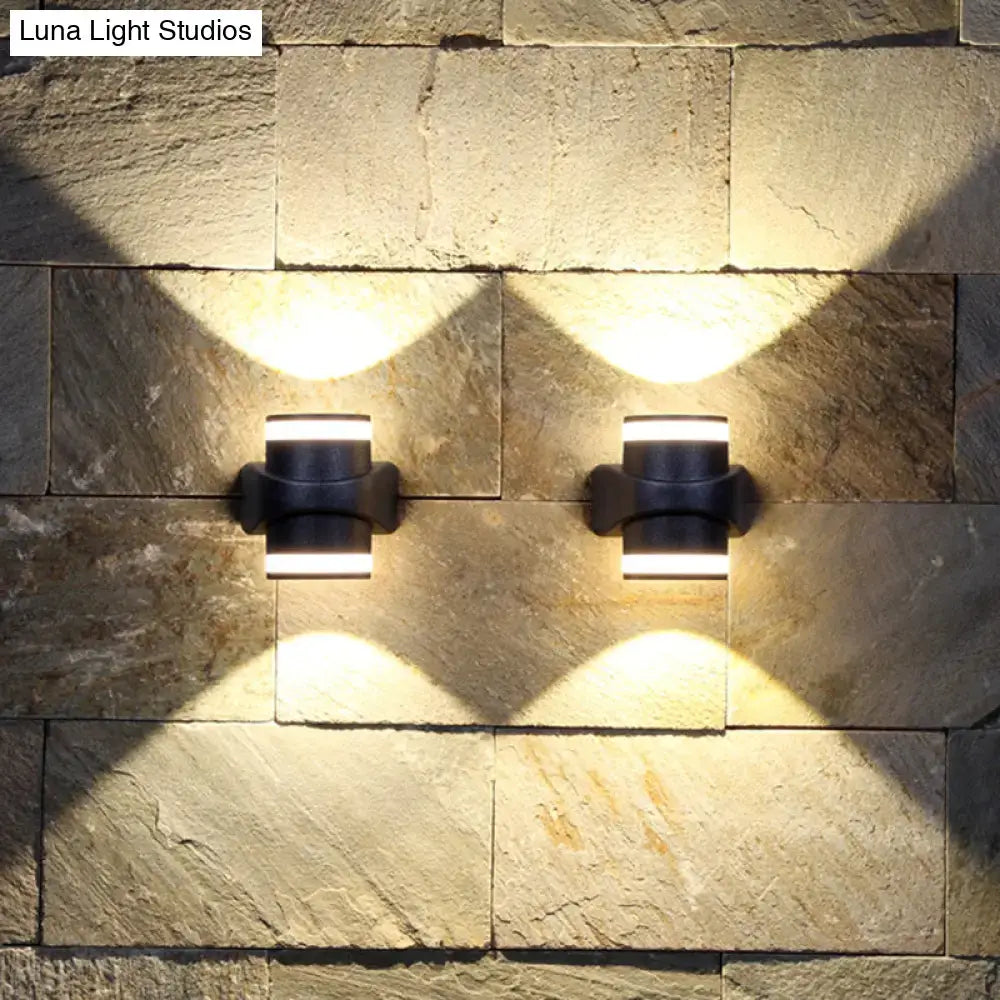 Modern black tubular metal wall washer sconce with sleek minimalist led design for backyard lighting
