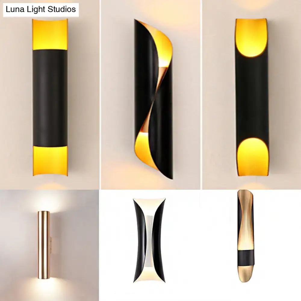 Modern black and gold wall mounted tubular bedside lamp with sleek curved design and e26 e27 bulb compatibility emitting warm light