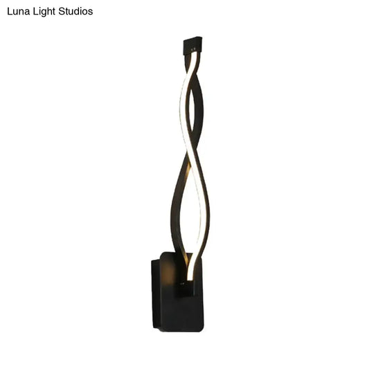 Modern black twisted led wall sconce with warm white light designed for stairway and bedroom lighting