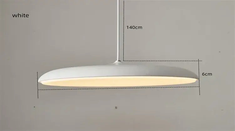 White sleek modern pendant light with minimalist design and warm glow as a modern design light source