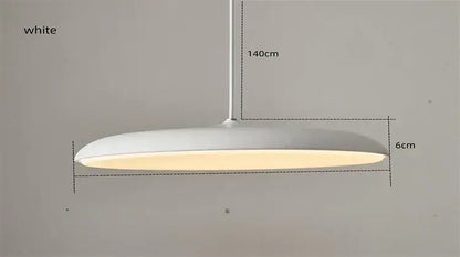 White sleek modern pendant light with minimalist design and warm glow as a modern design light source