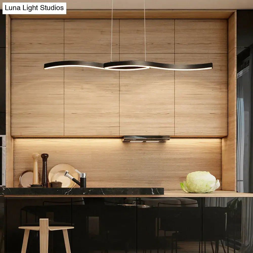 Modern black wave led hanging light fixture with sleek minimalist design above kitchen counter as hanging light fixture