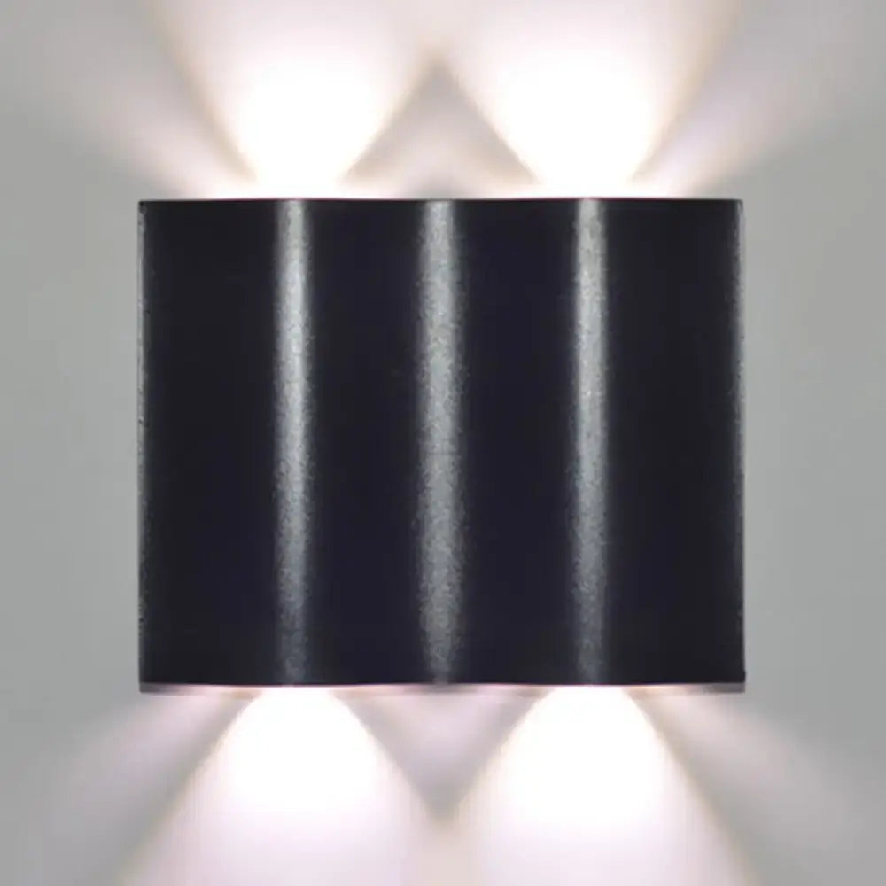 Modern black rectangular wall washer lamp with three vertical ridges and warm white lighting for porch use