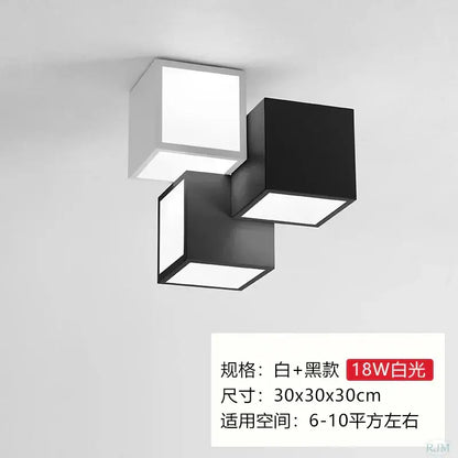 Modern black and white acrylic led ceiling light with three interlocking cube panels by decorbites