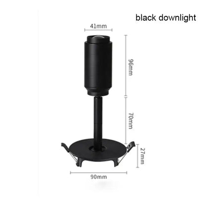 Modern black track spotlight with cylindrical head and metallic finish featuring adjustable beam angle design