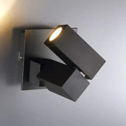 Modern black and white adjustable cube shade wall light with warm focused beam for living room lighting