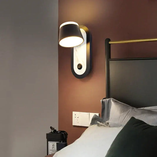 Modern black and white decorbites adjustable wall lamp with black shade and marble backplate featuring gold trim