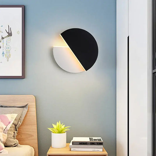 Modern black and white circular wall lamp with sleek minimalist design and decorbites adjustable wall lamp feature for reading