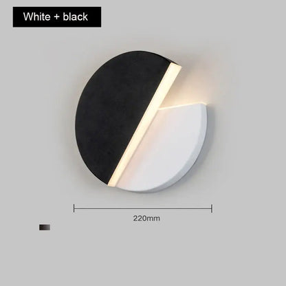 Modern black and white adjustable wall lamp with sleek circular design and warm led glow for bedroom reading light decorbites wall lamp