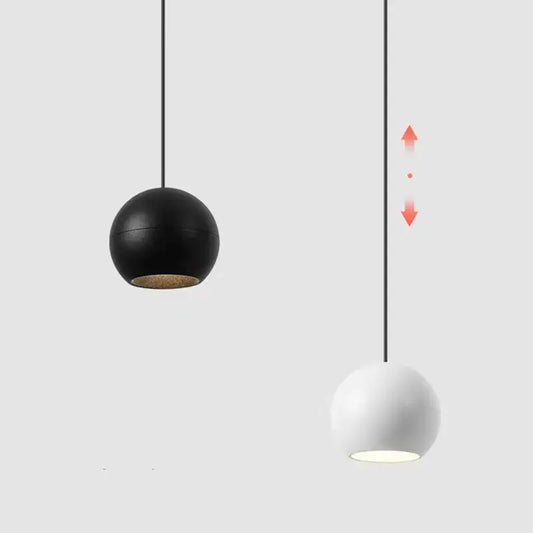 Modern black and white die-cast aluminum pendant light with matte finish and included cob led for dining room use
