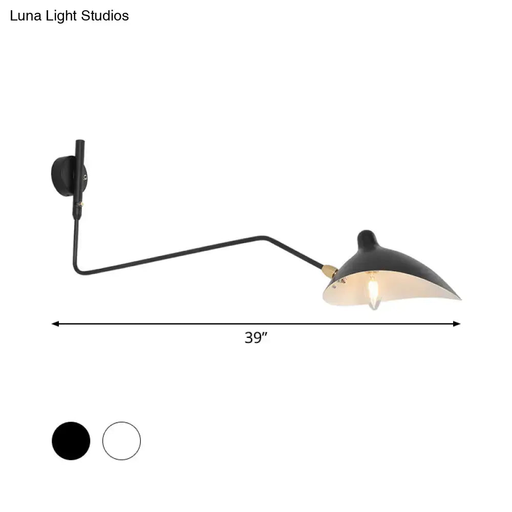 Modern black matte-finished wall sconce light fixture with curved arm and conical shade for living room use