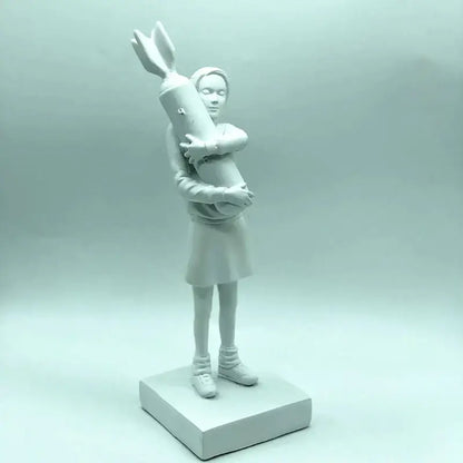 A matte white ceramic bomb hugger girl figurine holding a stylized rocket modern living room decorbites statue