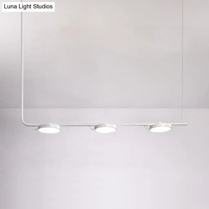 Minimalist white led track light with three circular fixtures on a sleek metal arm for modern chandelier dining room lighting with maximum bulb wattage