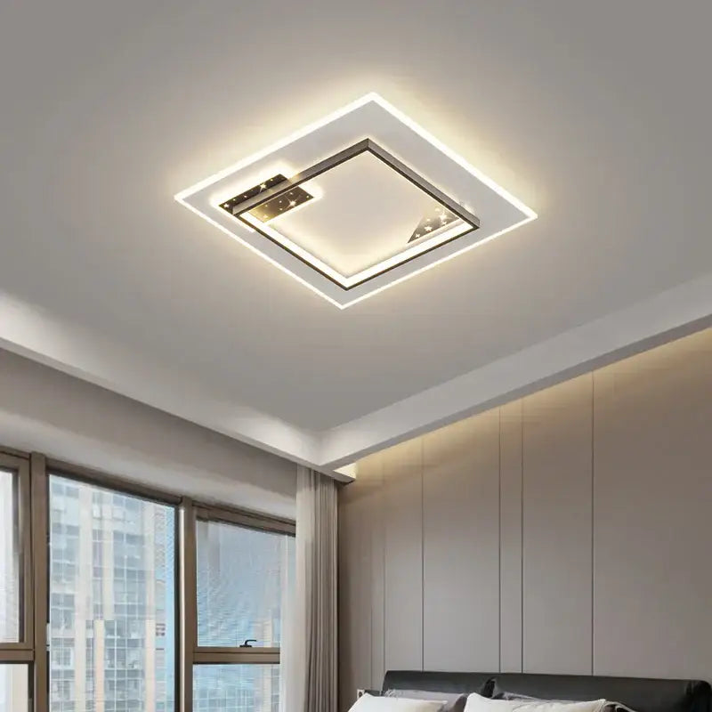 Modern black and white decorbites living lamp chandelier with sleek metallic frame and glowing LED edges for dining room