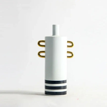 White ceramic vase with gold handles and black horizontal stripes for modern black and white dots geometric decor