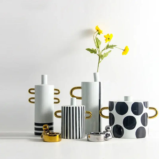 Modern black and white dots geometric ceramic vases with gold handles featuring bold stripes and white dots for living room decor