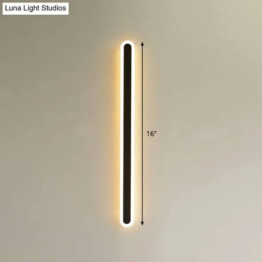 Modern black and white elliptical acrylic wall sconce with black central panel and glowing white led elliptical acrylic flush lighting