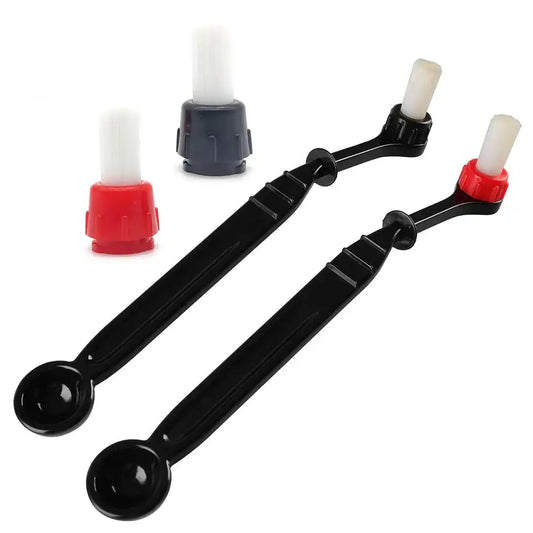 Modern black and white espresso machine brush cleaner with black plastic handles and white and red caps for decorbites espresso machine
