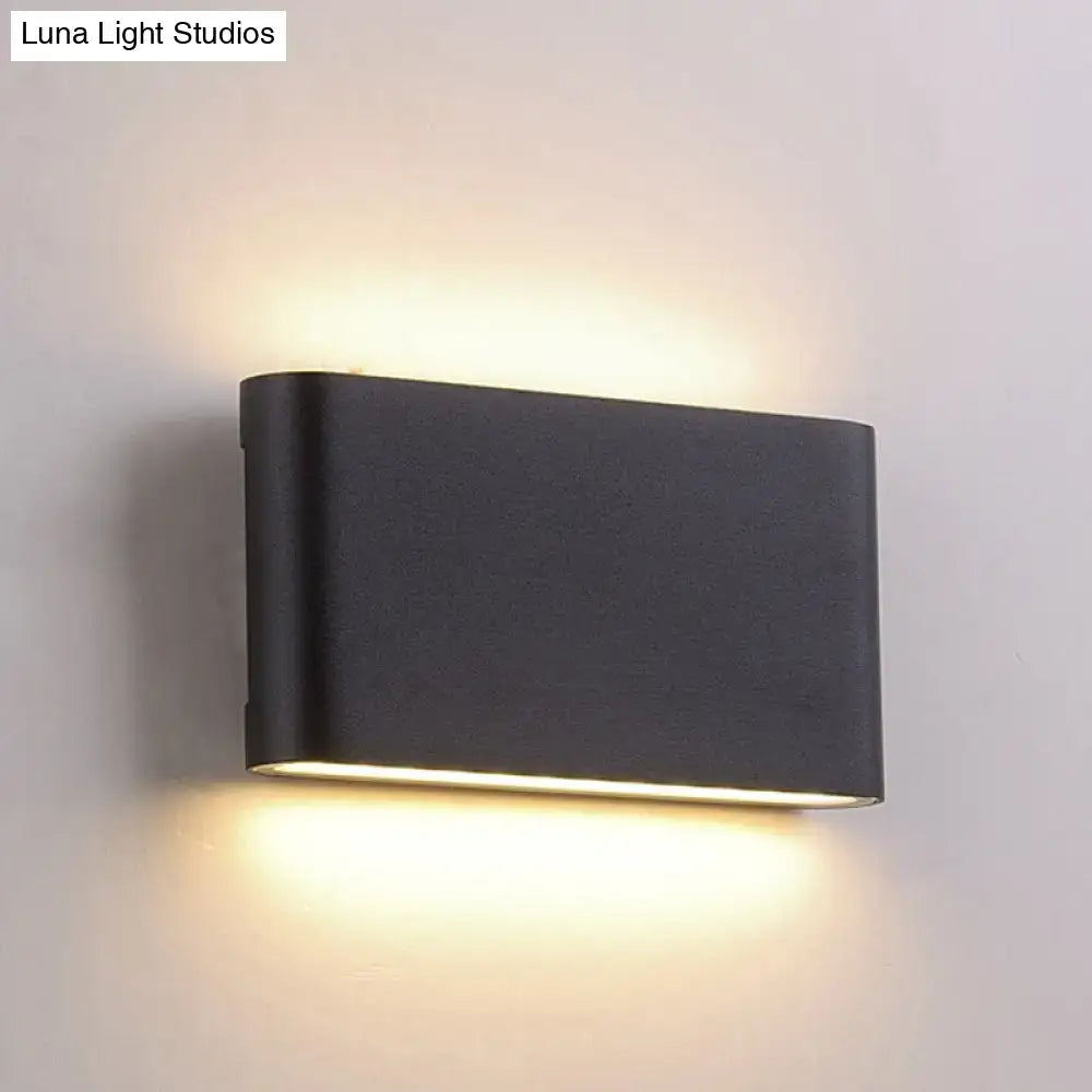 Modern black flush mount wall lamp with minimalist rectangular design and warm ambient sconce light for bedroom use