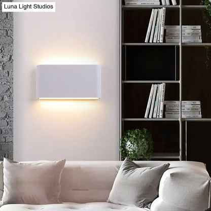 Modern black and white flush mount wall lamp with a sleek rectangular sconce light providing warm ambient lighting
