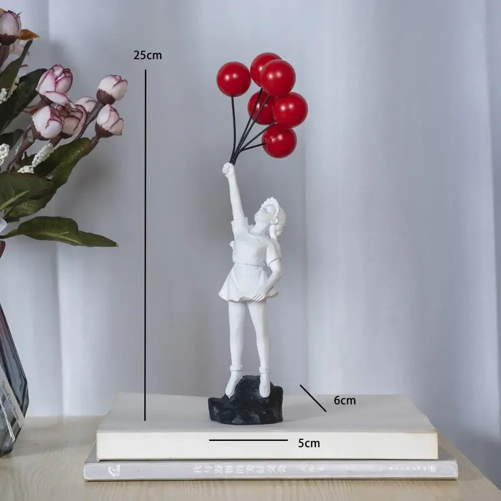 White resin decorbites flying love balloon girl sculpture holding red balloons on black base for living room decor