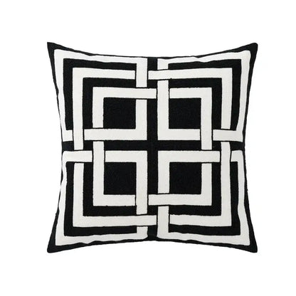 Modern black and white geometric embroidered cushion cover with bold interlocking square pattern for living room