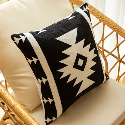 Modern black and white geometric embroidered cushion cover with bold tribal-inspired design for living room decor