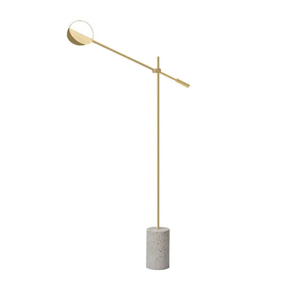 Modern gold-toned floor lamp with circular head and concrete base complementing decorbites geometric line pendant lamp