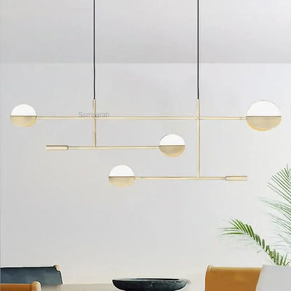 Modern black and white geometric line pendant lamp with gold-toned spherical glass shades for dining room decorbites geometric line