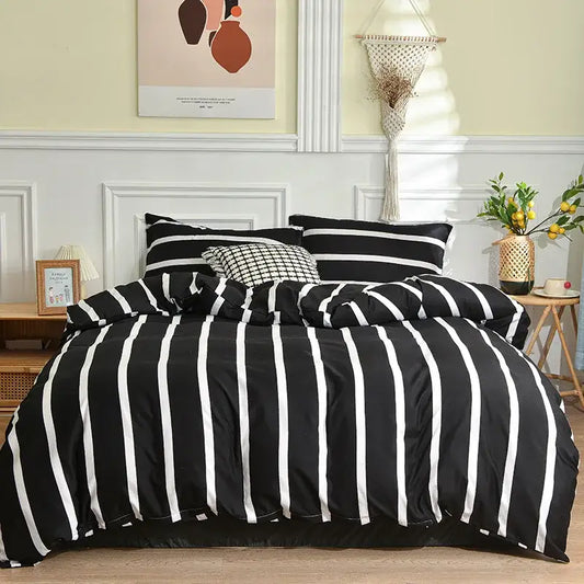 Modern black and white geometric stripes bedding set with vertically striped duvet cover and matching pillowcases by decorbites