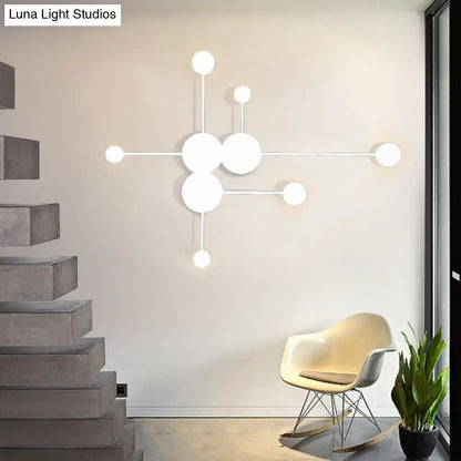 Modern white spherical wall sconce with minimalist geometric design as black and white wall light fixture for living room
