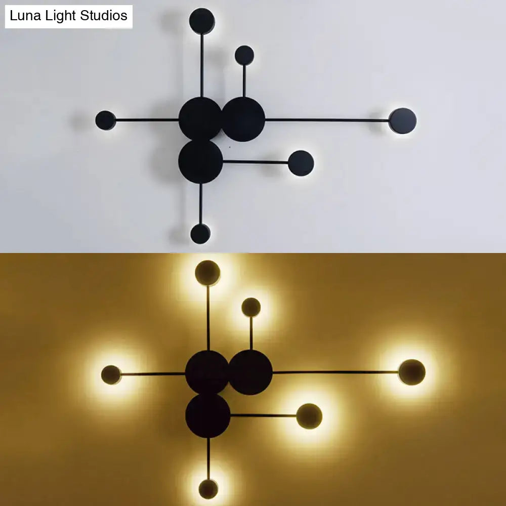 Modern black minimalist wall sconce with geometric molecular design featuring spherical bulbs for living room light fixture