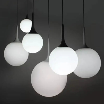 Modern black and white glass ball pendant lamp with frosted glass and black metal stems for dining room lighting decorbites glass ball
