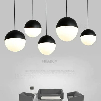 Modern black and white glass ball pendant lights with matte and glossy finishes for kitchen decorbites pendant lights