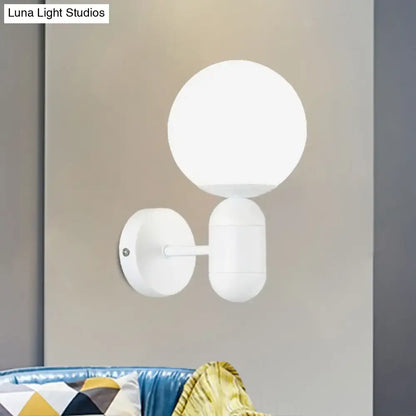 Modern black and white glass wall light featuring a white spherical matte glass wall lamp suitable for meeting rooms