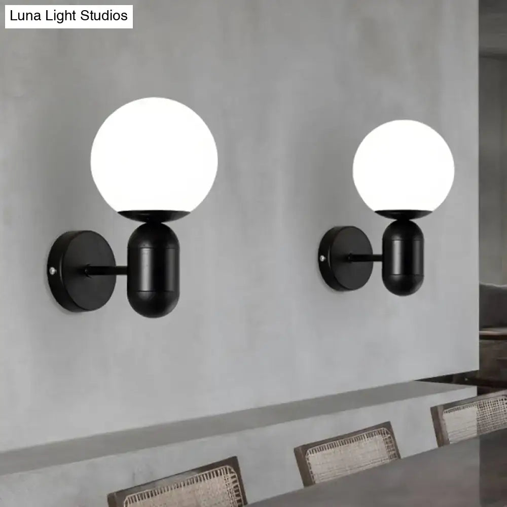 Modern black and white glass wall light with spherical shades designed as a meeting room globe sconce wall lamp