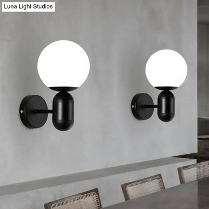 Modern black and white glass wall light with spherical shades designed as a meeting room globe sconce wall lamp