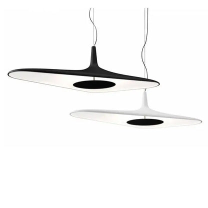 Modern black and white irregular pendant light with sleek elongated oval shapes and contrasting black centers for dining room decorbites