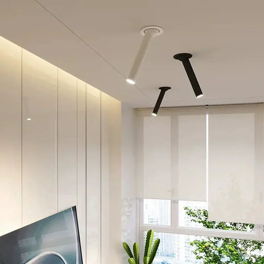 Two modern minimalist black and white led bar ceiling spotlights with sleek cylindrical bodies for kitchen lighting