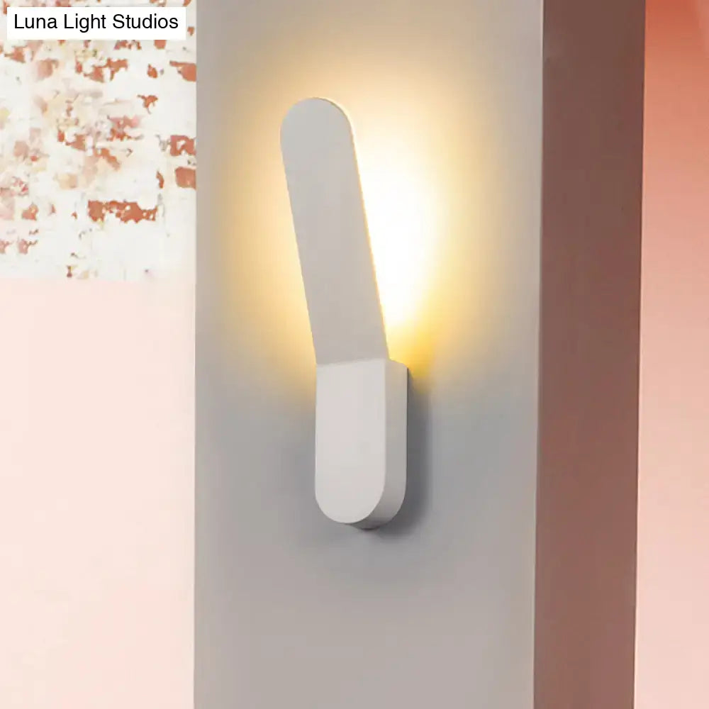 Modern black and white led lighting oval shape corridor wall sconce with a sleek white minimalist rectangular design emitting warm light