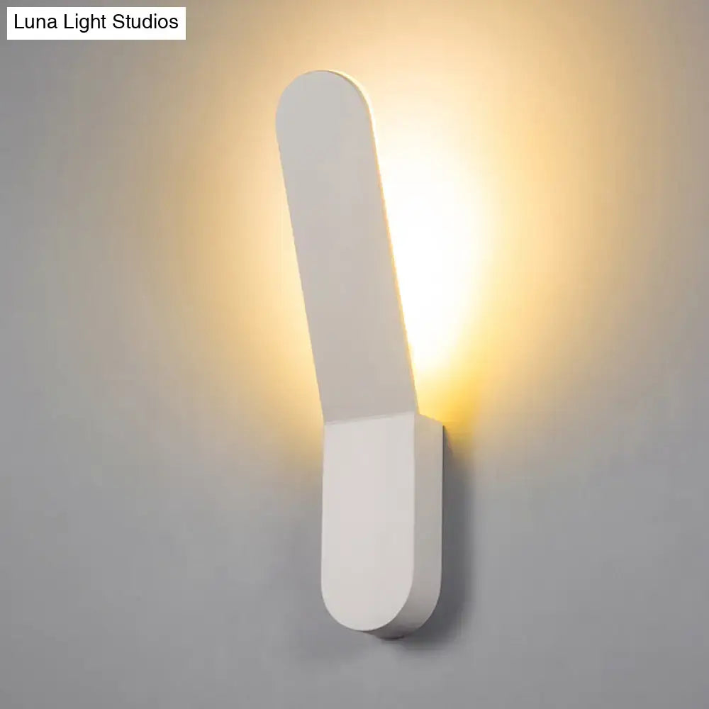 Modern black and white led lighting oval shape wall sconce with minimalist design emitting warm ambient light